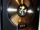 U2 original golden RIAA Award presented to U2 