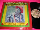 TRINITY - Shanty Town Determination. TR International 