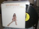 Bang Bang Lulu in New York with Sparrow's Troubadours LP Barbados sexy cover