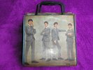 Beatles records in 1960's record case.