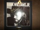 Framed Autographed Hank Williams Jr. Album With COA