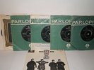 Six Beatles singles and 1 EP vinyl 45’s.