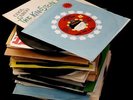 Assorted 45s from 60's and 70's in vintage record box