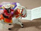 MONKEY RIDING HORSE CLOCKWORK METAL TOY - THE CURE STRANGE ATTRACTION Cover 1996