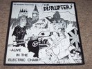 DISRUPTERS , ALIVE IN THE ELECTRIC CHAIR . WITH INSERT . LISTEN TO BOTH SIDES .