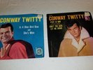 Pair of Conway Twitty picture sleeve 45's. C'est Si  Bon and is a Bluebird Blue.