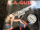 L.A.GUNS COCKED AND LOADED VINYL LP RECORD STILL IN THE SHRINK WRAP