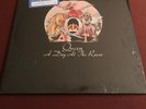 QUEEN - A Day At The Races - 1976 vinyl LP w shrink, hype, and ad for 1976 MSG