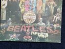 The Beatles Sgt Pepper LP First Press PMC 7027+Inner cut outs record is ex-