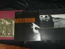 Three U2 12” Vinyl LP's (one is a double)Sleeves and records in good condition