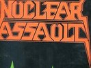 Nuclear Assault Brain Death VG+ LP in shrink.  Combat Records 1986 heavy metal.