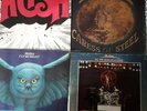 4 LP'S BY RUSH RUSH, CARESS OF STEEL, FLY BY NIGHT AND ALL THE WORLDS A STAGE