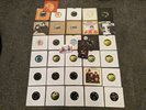 A large collection of The Beatles vinyl singles and promo postcards