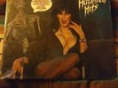 Elvira presents haunted hits rhino label R1 71492 with poster NM