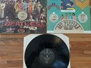 The Beatles SGT. Peppers Lonely Hearts Club Band vinyl LP with cutouts