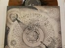 TRAPPED UNDER ICE SECRETS OF THE WORLD LP BRONZE W/BLACK VINYL BALTIMORE HC