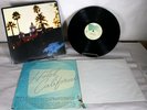 THE EAGLES - HOTEL CALIFORNIA VINYL RECORD ALBUM WITH POSTER