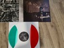 Pressed on three color strip vinyl (green, white, red). Housed a glo