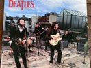A Vinyl 12” THE BEATLES Red Splatter Vinyl The Complete Rooftop Concert
