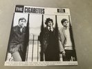 THE CIGARETTES RARE 7” THEY’RE BACK AGAIN, HERE THEY COME *RED LABEL 1ST PRESS*