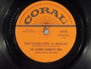 78 RPM  Johnny Burnett Trio, Coral 61719 Train Kept A-Rolin', V+/EE-  Rockabilly