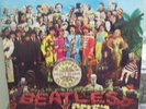 The Beatles Sgt. Pepper LP  1983 pressing with insert sheet of cutout badges