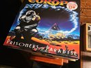 EUROPE - PRISONERS OF PARADISE - 1ST ISSUE LP - NM / NM ARCHIVE STANDARD LP SONY